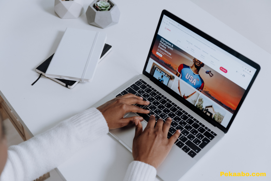 What Is a Performance Marketing Agency and When Should You Hire One? 1 Digital marketer researching online campaigns on laptop for performance marketing strategy