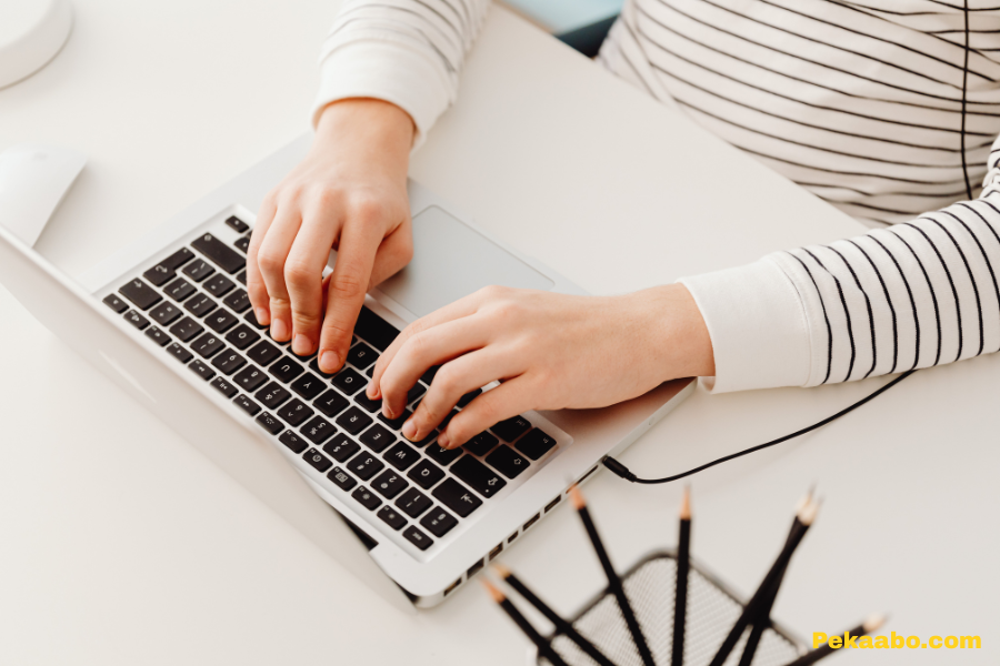 Email Marketing for Ecommerce: Campaigns That Drive Repeat Purchases 2 Person typing on laptop while planning ecommerce email marketing campaigns
