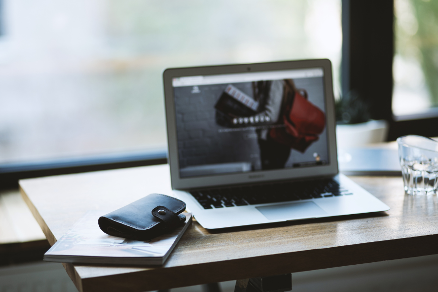 SEO Services for SaaS Companies: From Keyword Demand to Pipeline 2 Laptop displaying a SaaS website during an SEO strategy and pipeline review